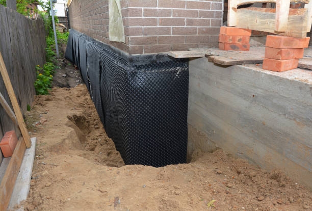 Happy homeowners after waterproofing job in Parker Ford